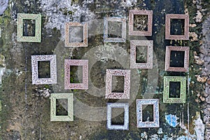 Beautiful empty picture frames hanging on the old wall on a street in Stone Town of Zanzibar Island, Tanzania, Africa, close up
