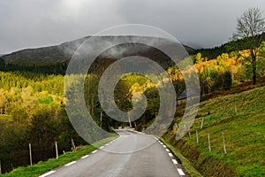 Beautiful empty road in Pyrenees. Autumn sunrise, shadows and co