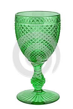 Beautiful empty wine glass isolated on white background. Christmas coloured glass. The shape of the glass is reminiscent of old-