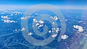 Beautiful endless panorama from the height of flying airplane above the clouds