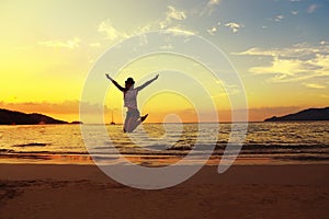 Beautiful energy young woman silhouette jumping on beautiful sun