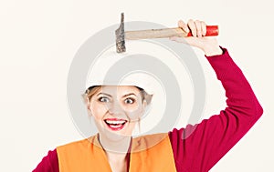 Beautiful engineering woman using hammer and tools