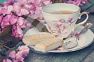 Beautiful, English, vintage teacup with Japanese cherry tree blossoms,