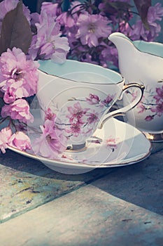 Beautiful, English, vintage teacup with Japanese cherry tree blossoms, close up