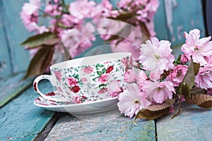 Beautiful, English, vintage teacup with Japanese cherry tree blossoms, close up