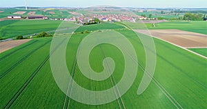 Beautiful European landscape. Green fields around a small town. Small European city aerial view. german village aerial