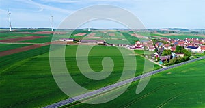 Beautiful European landscape. Green fields around a small town. Small European city aerial view. german village aerial