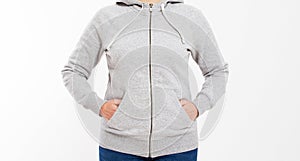 Beautiful european mid aged woman dressed in a light grey casual hooded jacket - studio shot in front of a white background