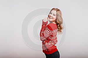 Beautiful European woman model in a trendy red sweater