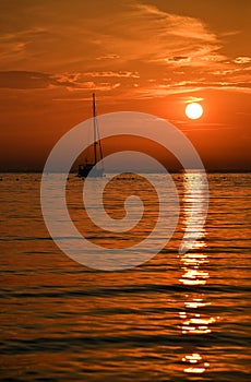 Beautiful evening Adriatic sea, yacht and sunset sky, Croatia. Evening seascape