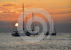 Beautiful evening Adriatic sea, yachts and sunset sky, Croatia. Evening seascape