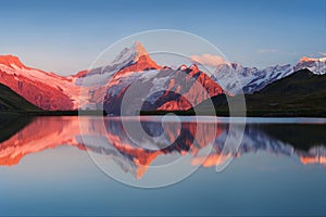 Beautiful evening panorama from Bachalp lake / Bachalpsee, Switzerland. Picturesque summer sunset in swiss Alps , Grindelwald.