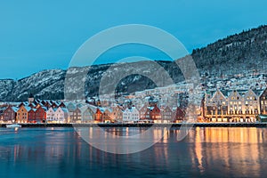 Beautiful evening panorama of Bergen waterfront, Bryggen area. Magical cityscape at night, visible colorful houses of Bergen. Long