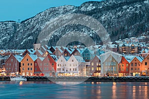 Beautiful evening panorama of Bergen waterfront, Bryggen area. Magical cityscape at night, visible colorful houses of Bergen. Long