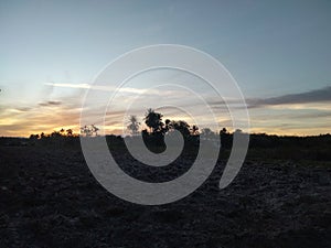 Beautiful evening sky and clouds over the fields view