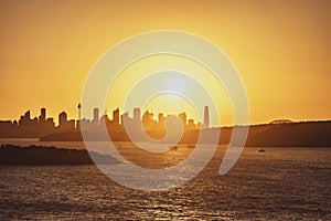 Beautiful evening sunset shot of the Sydney Harbour with the Sydney skyline in the background, seen from Fairfax Lookout