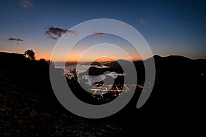 beautiful evening view of beach and mountain and city lights of Oludeniz