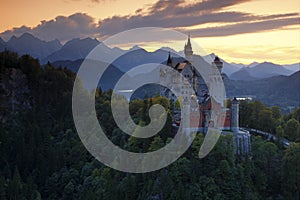 Beautiful evening view of the fairy tale Neuschwanstein castle, with autumn colours during sunset, Bavarian Alps, Bavaria, Germany