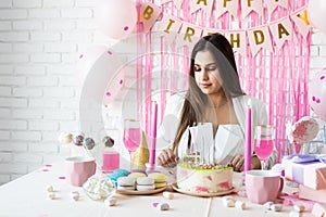 Beautiful excited woman celebrating birthday party