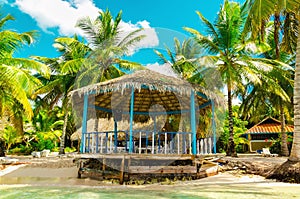 Beautiful exotic beach with wooden gazebo, Dominican Republic, Caribbean island