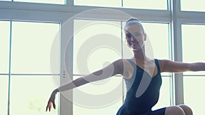 Beautiful expressive ballet dancer dancing at studio. Smoke Photo Shoot. Pretty little girl ballerina in pink dress