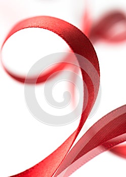 Beautiful fabric red ribbon on white