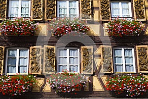 Beautiful facade of an ancient half-timbered house with  windows