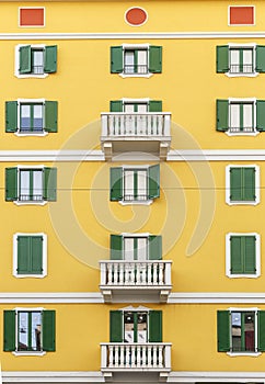 Beautiful facade of the building in one of the streets of Milan