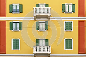 Beautiful facade of the building in one of the streets of Milan