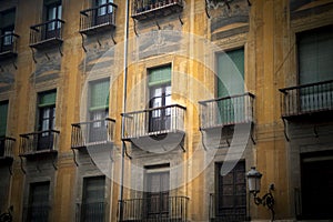 Beautiful facade of an old building in the cathedral square of Granada, Spain.