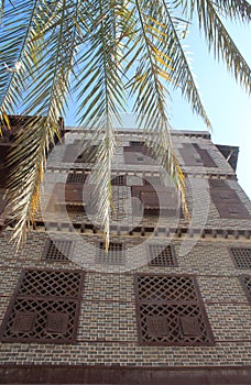 Beautiful facade of an old house in Rashid with its big wooden windows photo