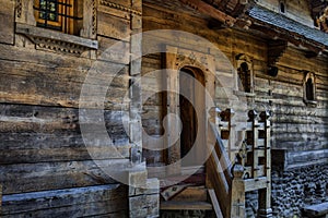 Beautiful facade of an old medieval small wooden church in Barsana, Romania