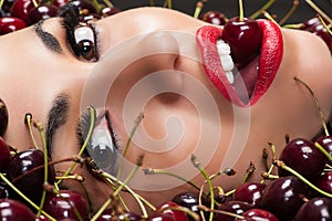 Beautiful face in cherry closeup