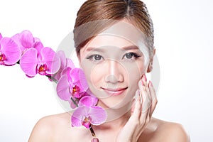 Beautiful face with pink orchids