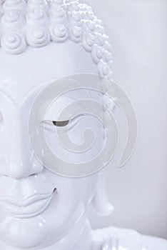 Beautiful face of white Buddha image