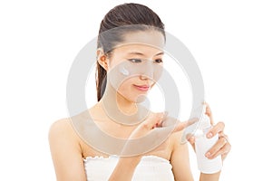 beautiful face of woman applying moisturize cream photo