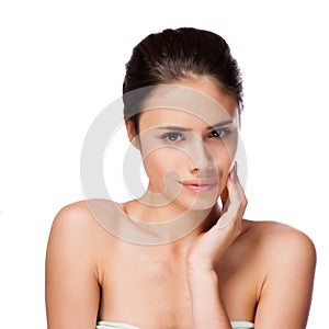 Beautiful face of young adult woman with clean fresh skin