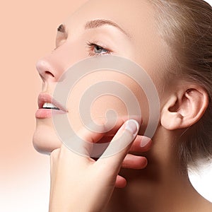 Beautiful face of young adult woman with clean fresh skin - . Beautiful girl with beautiful makeup, youth and skin care