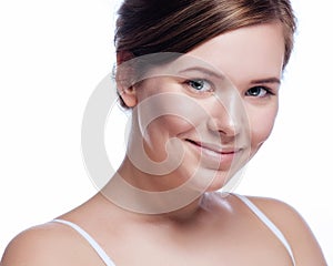 Beautiful face of young adult woman with clean fresh skin - isolated on white