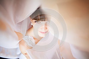 Beautiful Face of Young Blond Bride Woman. Beauty Morning Portrait.Girl Look in Window. Bridal Veil. Curtains