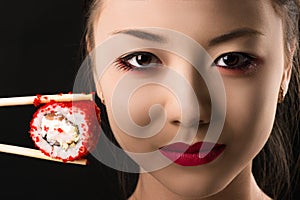 Beautiful face young Korean girl with roll, bright makeup