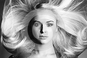 Beautiful Face of Young Woman. Blond girl. monochrome portrait. Beautiful healthy hair. Beauty salon photo
