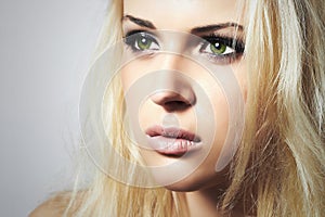 Beautiful Face of Young Woman.Blond girl.sad woman with green eyes