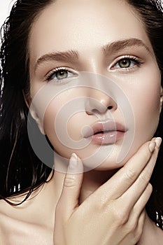 Beautiful Face of young Woman. Skincare, Wellness, Spa. Clean soft Skin, Fresh look. Natural daily makeup, wet hair
