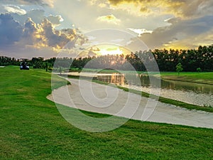 Beautiful fairway sand bunkers and lake in the golf course