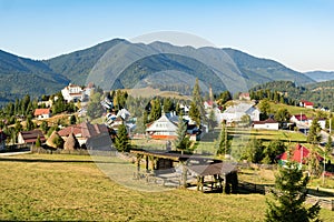 Beautiful fairytale landscape of Tihuta pass Village in North Romania during sunny autumn day