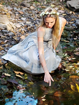 Beautiful Fairytale Princess Sitting By Water Pond