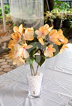 Beautiful fake flower on the table