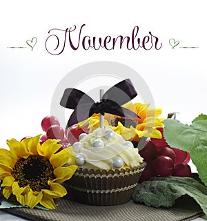 Beautiful Fall Thanksgiving theme cupcake with seasonal flowers and decorations for the month of November