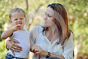 Happy mother with smiling laughing baby boy